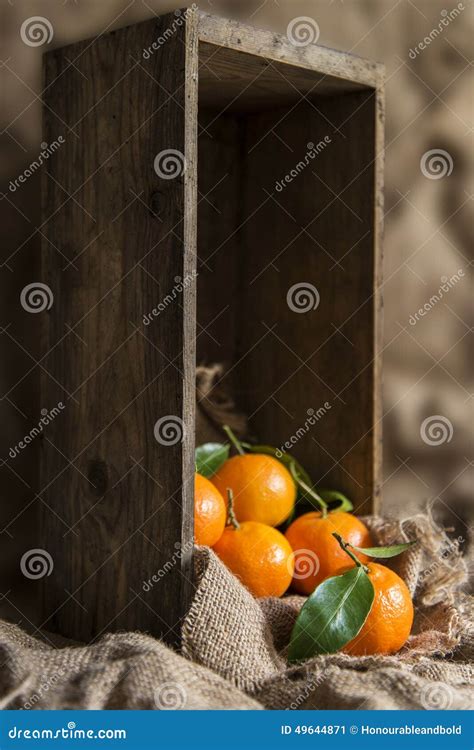 Oranges on Stalk in Rustic Kitchen Setting with Old Wooden Box a Stock Image - Image of sack ...