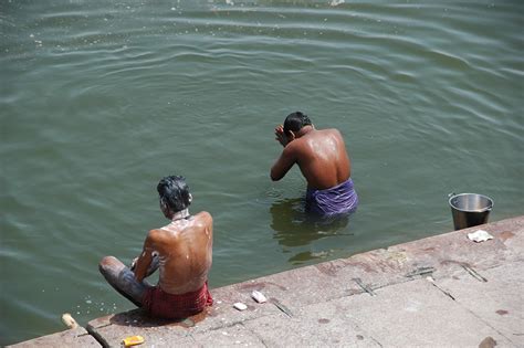 Varanasi - Benares, Uttar Pradesh, India / VNS Varanasi or Benares - washing and taking a ritual ...