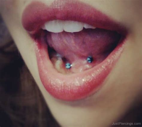 Lingual Frenulum Piercing With Blue Barbell