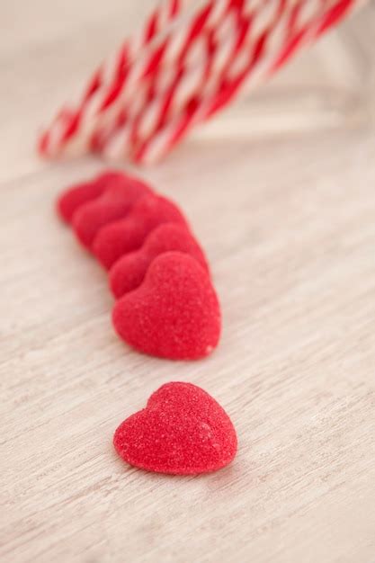 Premium Photo | Candy canes and heart-shaped candies