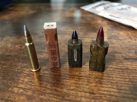 Different generations HK G11 Caseless Ammunition next to a .17 HMR for ...