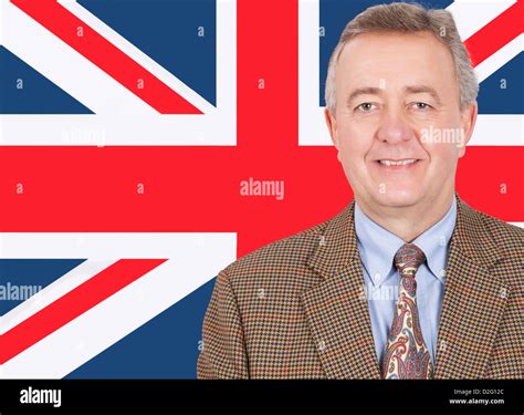Portrait of smiling middle-aged businessman over British flag Stock Photo - Alamy