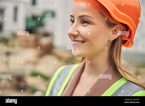 Female civil engineer wearing a hard hat Stock Photo - Alamy