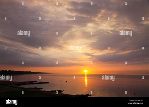 Sunrise over Kattegat strait in Fredericia city, Denmark. Kattegat is a sea strait connecting ...