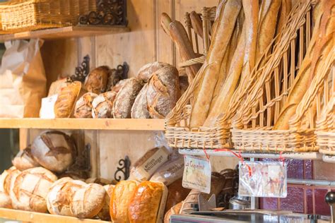 Fresh baked breads on display at a bakery in Paris : food