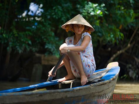 young woman on a boat. Mekong river delta, Vietnam, Asia | Mikel Bilbao Photos