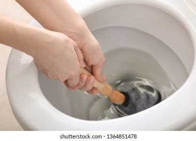 Young Woman Using Plunger Unclog Toilet Stock Photo 1364851478 | Shutterstock