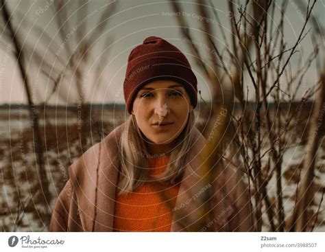 Portrait of a fashionably dressed woman in winter landscape - a Royalty Free Stock Photo from ...