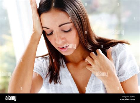 Woman with headache Stock Photo - Alamy