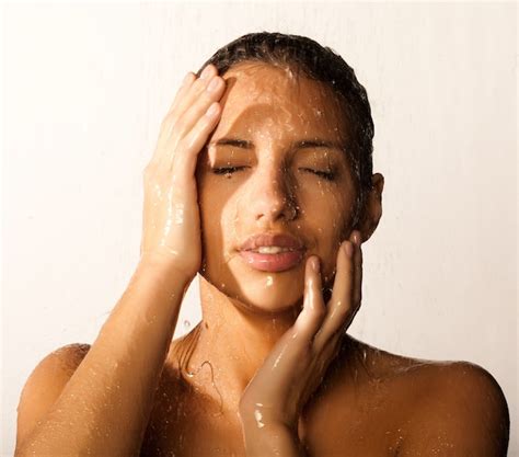 Premium Photo | Close-up of beautiful wet woman face with water drop. on white background
