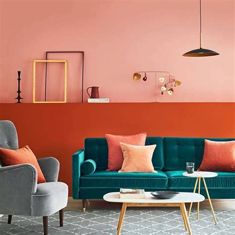 Coral with strong undertones of orange makes a striking contrast with complimentary teal sofa ...