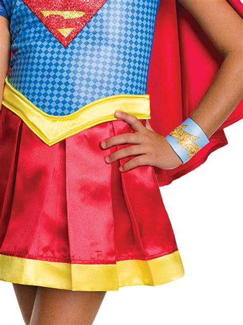 Includes Top digitally printed pattern, short sleeves, large glitter Supergirl logo on chest ...
