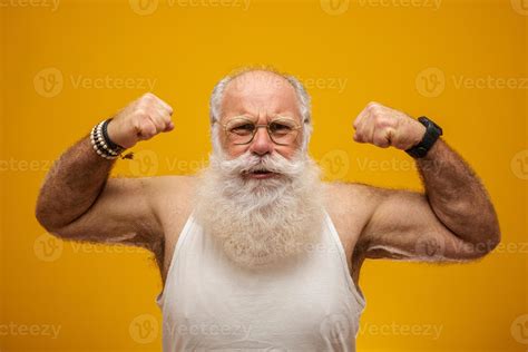 Old man with long white beard showing his strength with his arms ...