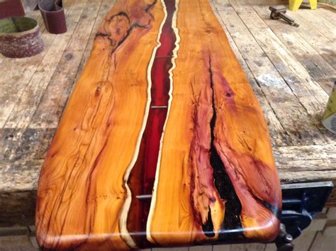 Live edge Yew. Coffee table top with Amber resin flowing through the wood. Green Tree Furniture ...