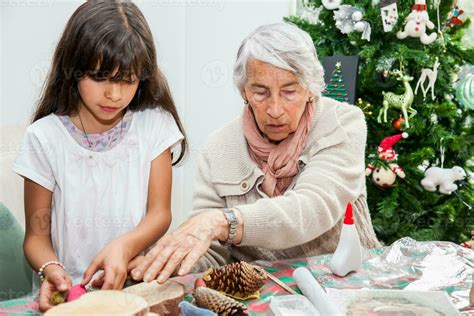 Grandmother teaching her granddaughter how to make christmas Nativity crafts - Real family ...