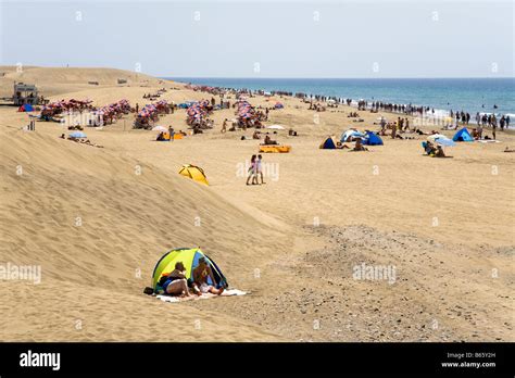 Masses of people sunbathing on beach Maspalomas Gran Canaria Spain Stock Photo - Alamy