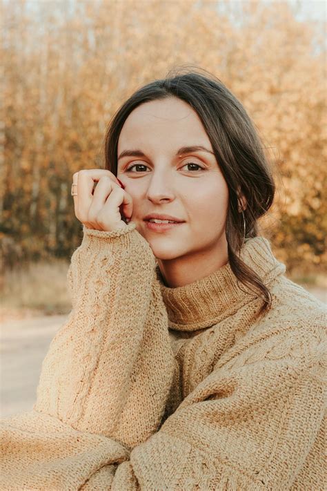 Woman Wearing Brown Long-sleeved Sweater · Free Stock Photo