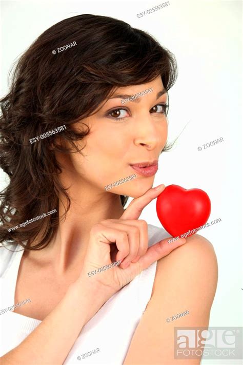 a brunette woman and a little red plastic heart, Stock Photo, Picture And Low Budget Royalty ...