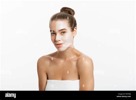 Woman with lifting cream applied on a half of her face, isolated on white Stock Photo - Alamy