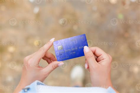 Hand holding credit card 17027349 Stock Photo at Vecteezy