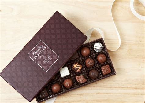 assorted chocolate truffles in box with white ribbon on wo… | Flickr