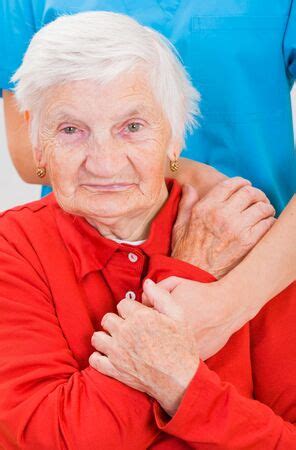 Young doctor giving helping hands for elderly woman - Stock Image - Everypixel