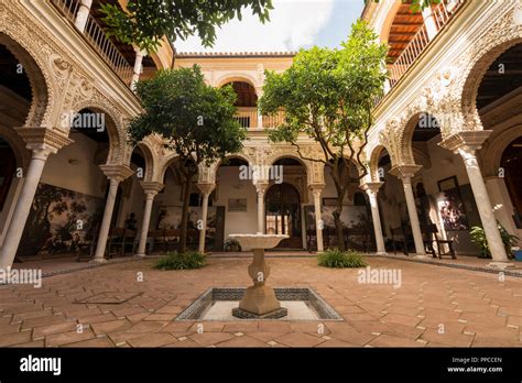 Courtyard with portico, Arabic architecture, Casa de los Pinelo, Andalusia, Spain Stock Photo ...