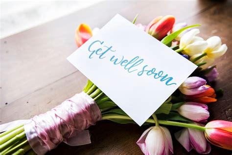 Premium Photo | Tulips flowers bouquet with get well soon wishing card