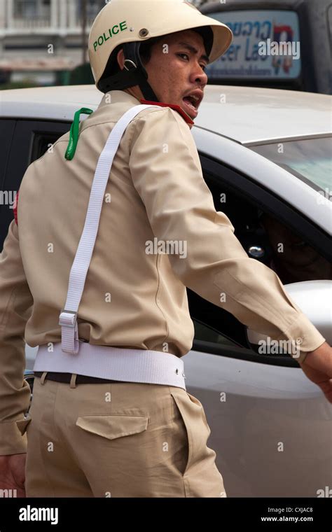 Laos police hi-res stock photography and images - Alamy