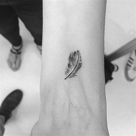 57 Attractive Wrist Feather Tattoos