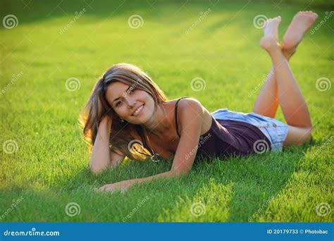 Gorgeous Young Woman Lying Down on Grass Stock Image - Image of happy, outdoor: 20179733