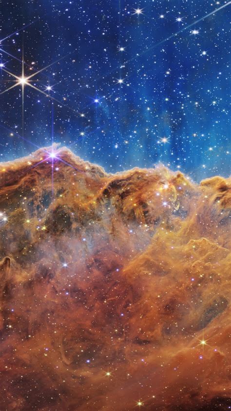 Download wallpaper: Cosmic Cliffs in the Carina Nebula 1242x2208