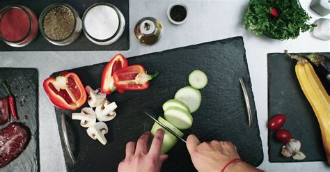 Cutting Vegetables To Pieces In A Chopping Board · Free Stock Video