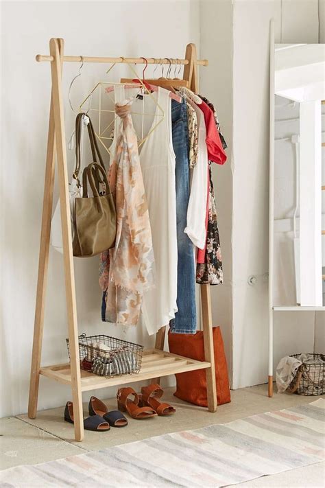 Urban Outfitters Wooden Clothing Rack | Wood clothing rack, Wood clothes, Clothing rack