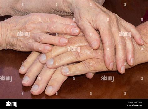 Old people holding hands. Closeup Stock Photo - Alamy