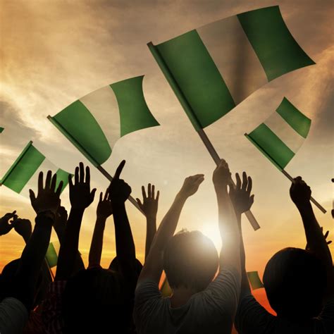 Silhouettes of People Holding Flag of Nigeria - PAI