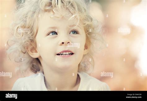 Blonde baby girl smiling outdoor. Closeup vintage portrait Stock Photo ...