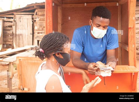 a young man counting cash during a transaction Stock Photo - Alamy