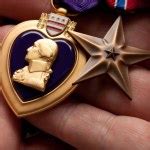 Man Holding Purple Heart War Medal Stock Photo by ©Feverpitch 2360526