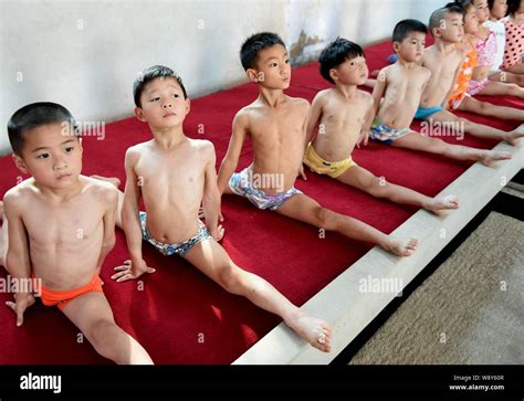 Chinese children do the splits to practice gymnastics at a gymnastics ...