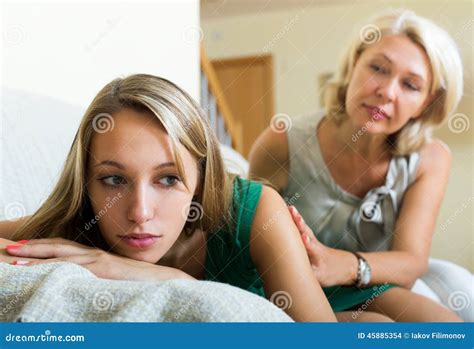 Mother Comforting Crying Daughter Stock Photo | CartoonDealer.com #45885354