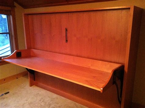 Murphy DeskBed in Alder with bronze bar pull. The second of 38 units to be installed. © Murphy ...