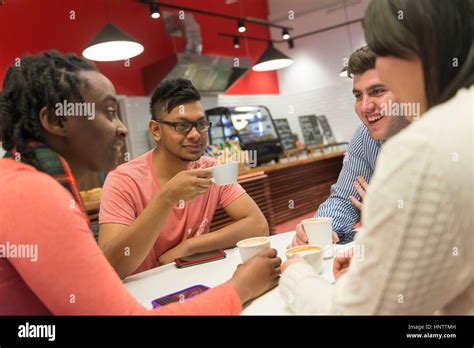 Friends in a coffee shop Stock Photo - Alamy