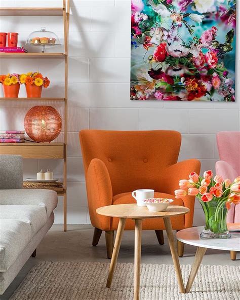 Love the orange chair as the center of the room. #orange #interiordesign #… | Rustic living room ...