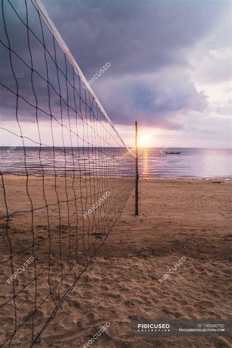 Volleyball net at sunset sand beach — vacation, thailand - Stock Photo | #190040792