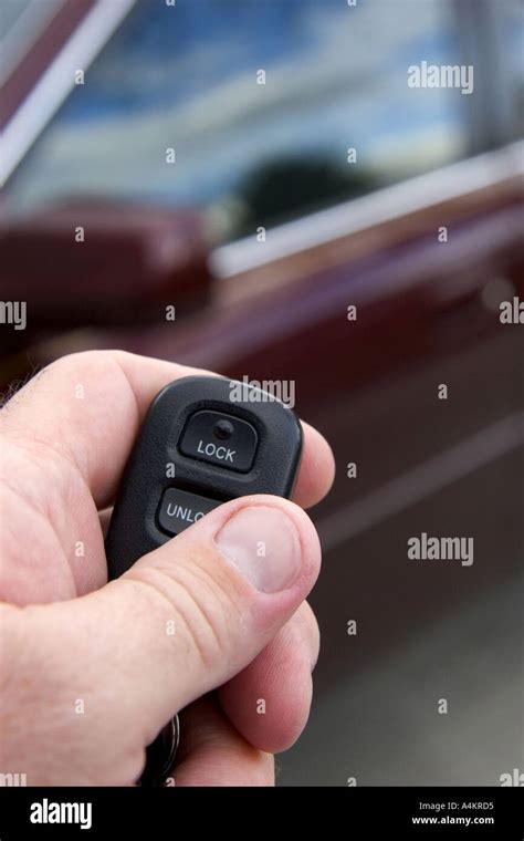 Person using a remote system to lock and unlock car doors Stock Photo - Alamy