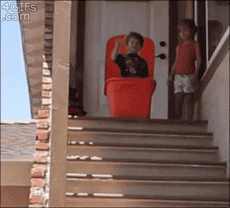 A kid is sealed in a plastic bin and pushed down stairs | GIF | PrimoGIF