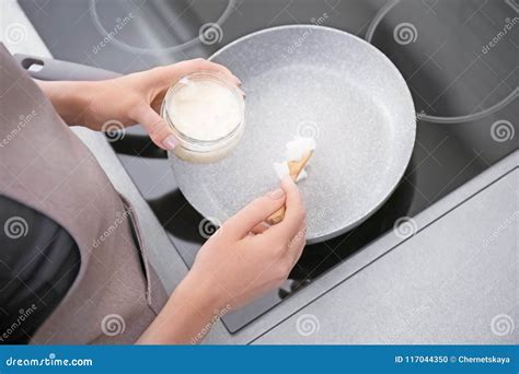 Woman Putting Coconut Oil on Frying Pan in Kitchen, Stock Photo - Image of diet, delicious ...