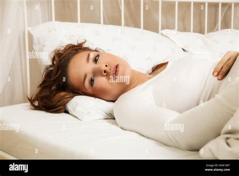 Beautiful woman sleeping in bed hi-res stock photography and images - Alamy