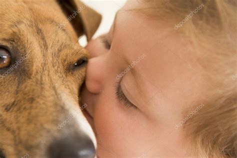 Baby kissing dog — Stock Photo © monkeybusiness #4766459